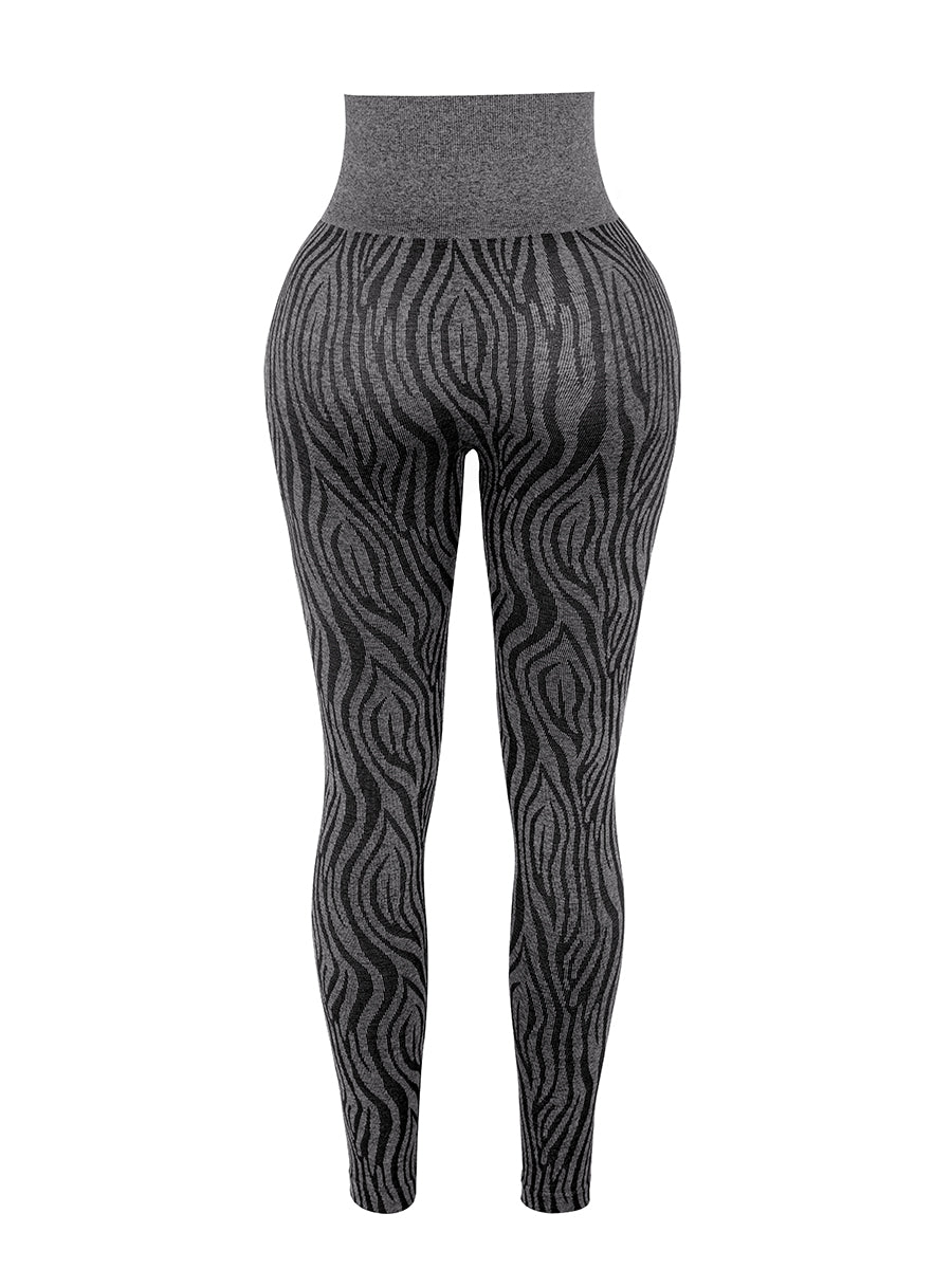 a woman wearing a black and white patterned leggings