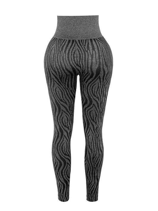 a woman wearing a black and white patterned leggings