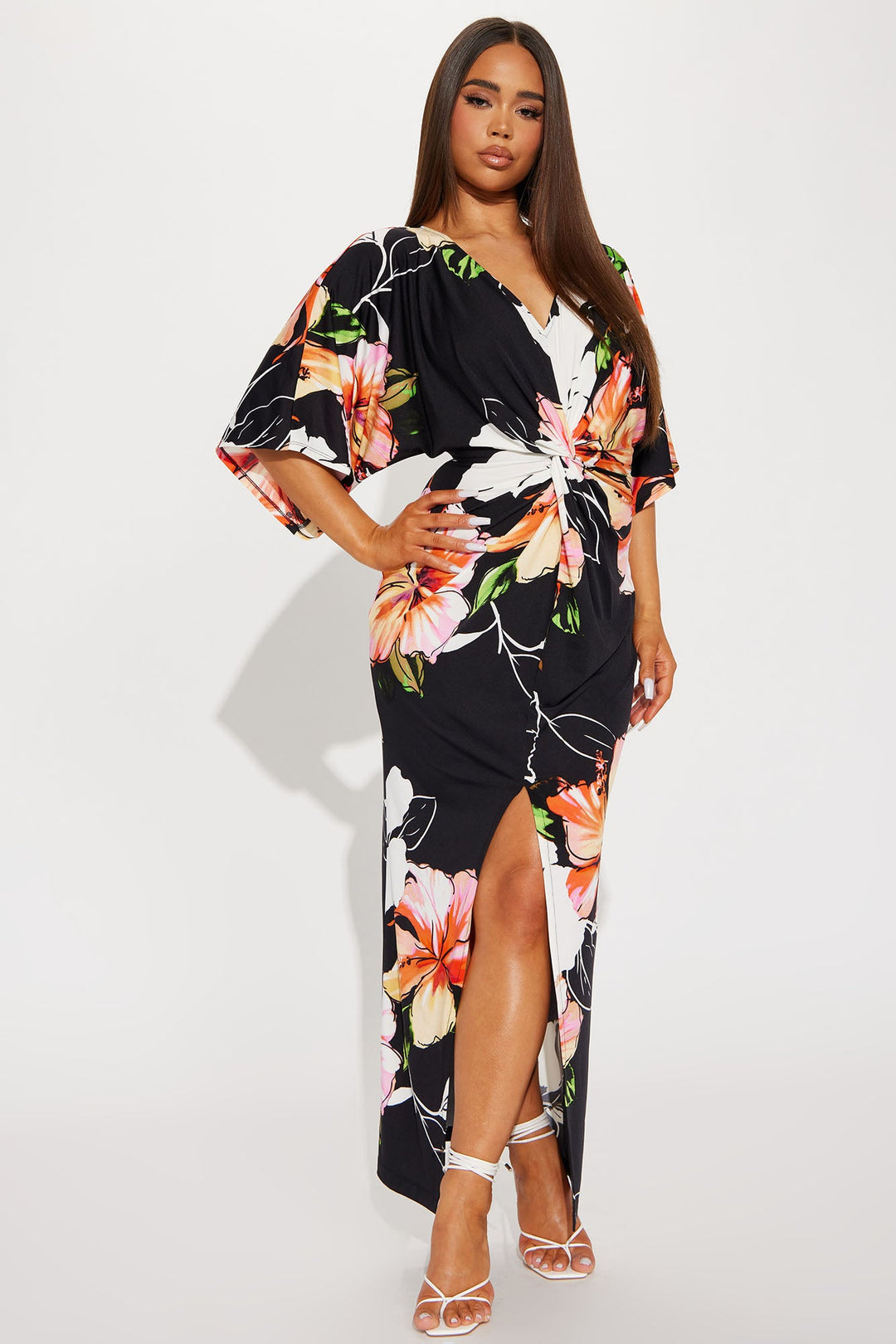 Woman wearing a floral dress with a white background