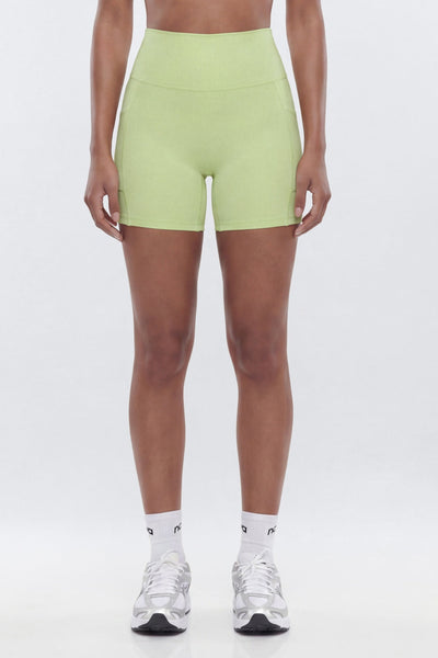 yoga shorts wear by a person in stock and trainers with a white background