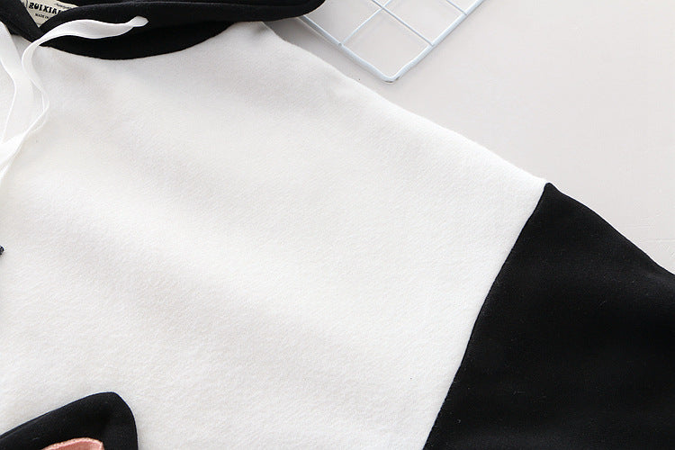 Front view of the Women’s Oversized Hoodie, featuring a spacious pocket and drawstring hood, ideal for added comfort.