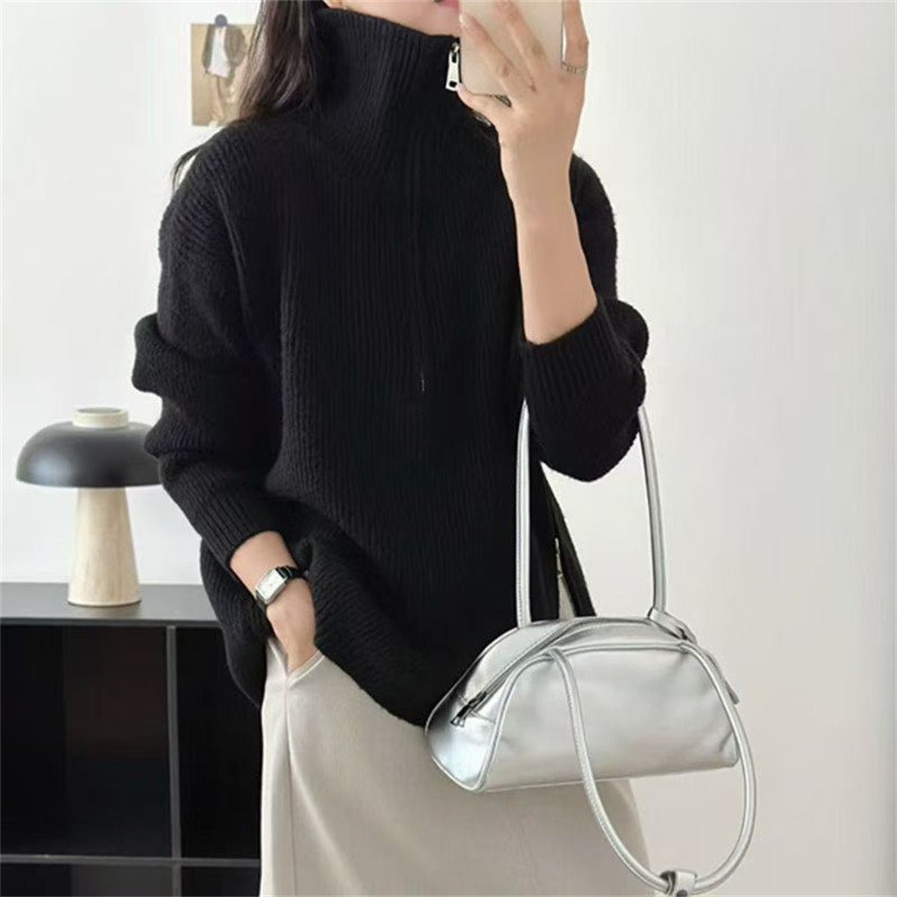 Loose long sleeved sweater with slit hem