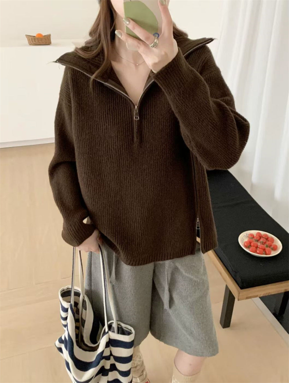 Loose long sleeved sweater with slit hem