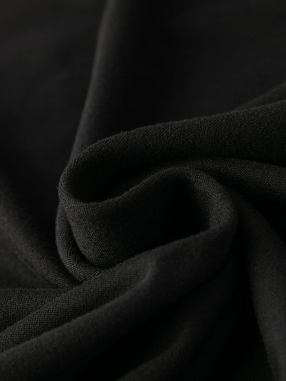 Side view of the Women's Y2K Jamaica Graphic Print Crop Tank Top Black, emphasizing the sleeveless design and stretchable fabric.