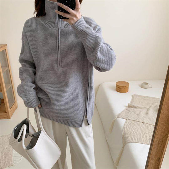 Loose long sleeved sweater with slit hem