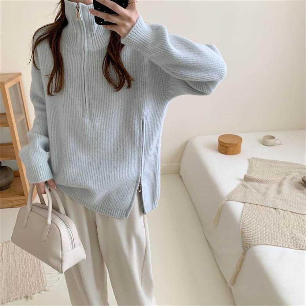 Loose long sleeved sweater with slit hem