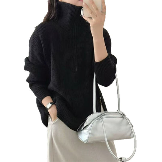 Loose long sleeved sweater with slit hem
