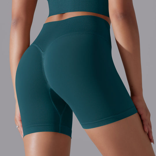 Teal athletic outfit on a plain background