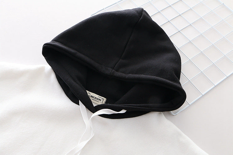 Lifestyle image of the Women’s Oversized Hoodie worn by a student, reflecting the casual and stylish look suitable for everyday wear.