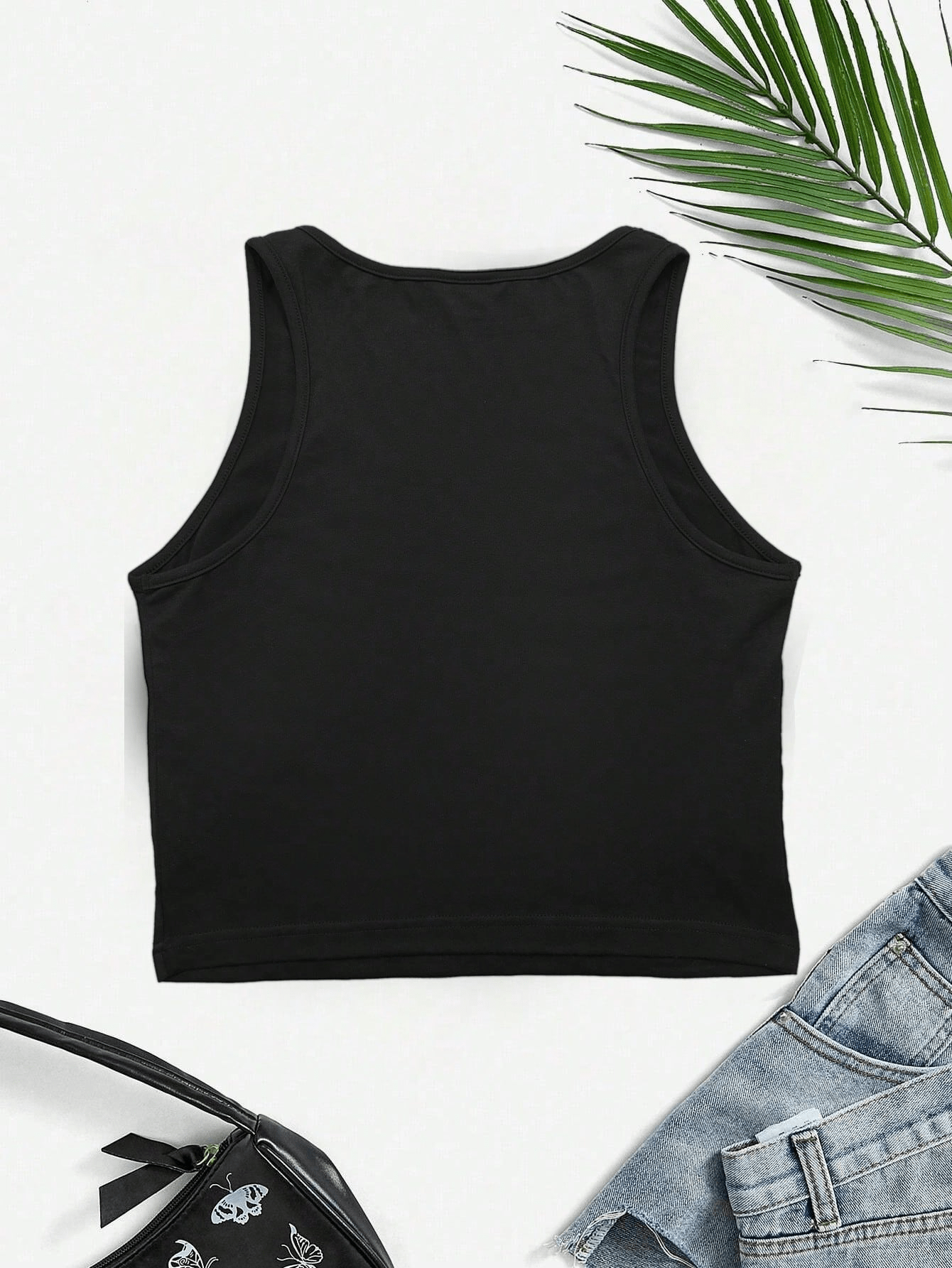 Close-up of the graphic design on the Women's Y2K Jamaica Graphic Print Crop Tank Top Black, highlighting the unique Y2K style.