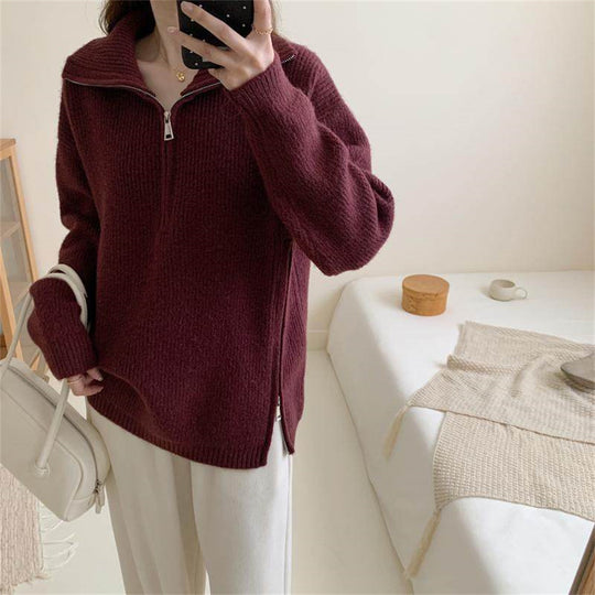 Loose long sleeved sweater with slit hem