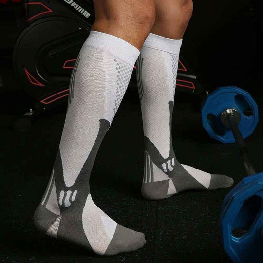 Long tube compression socks shown on leg – graduated pressure for calf muscle support