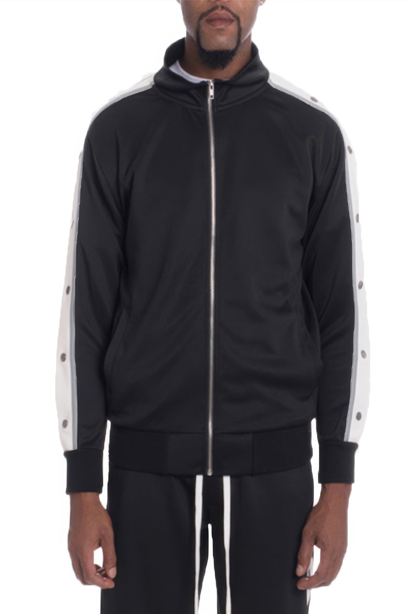 Black tracksuit with white stripes on sleeves and sides, worn by a person on a white background