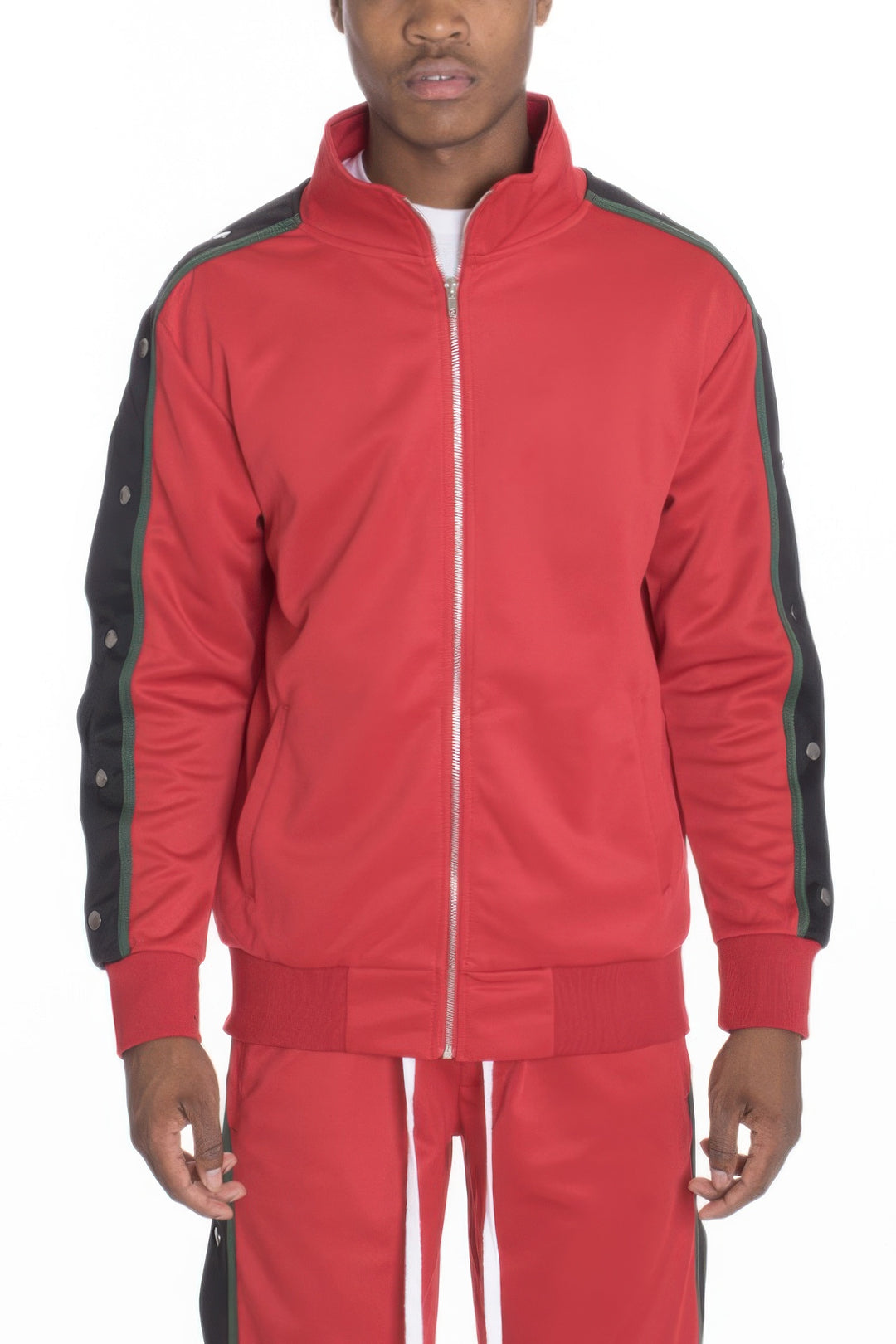 Red tracksuit with black accents worn by a person on a white background