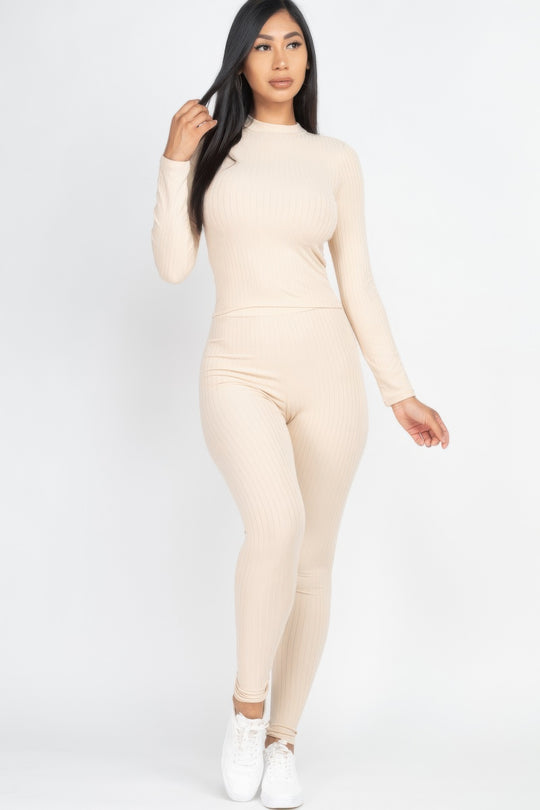 Woman wearing a beige outfit on a white background
