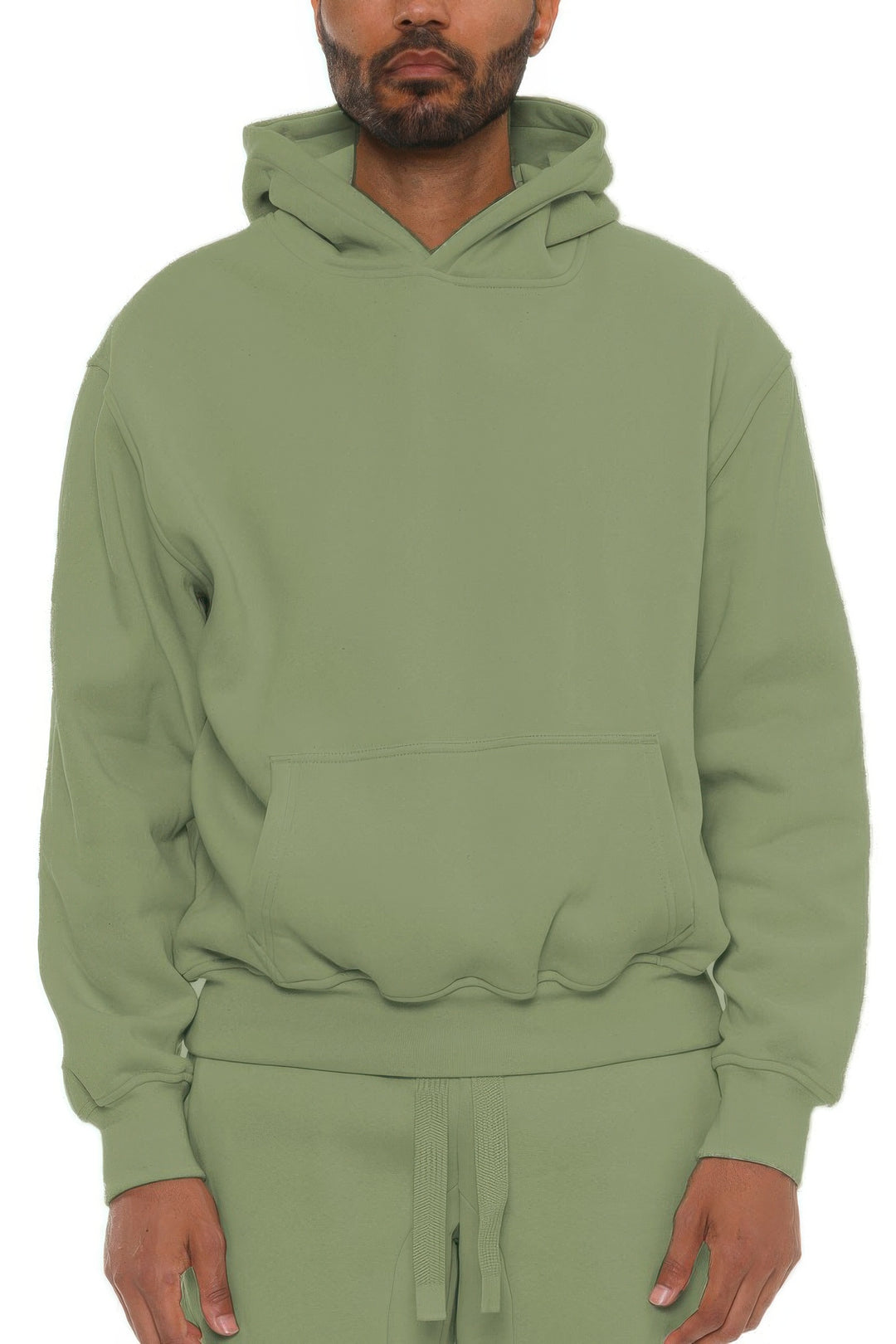 Person wearing a green hoodie on a white background