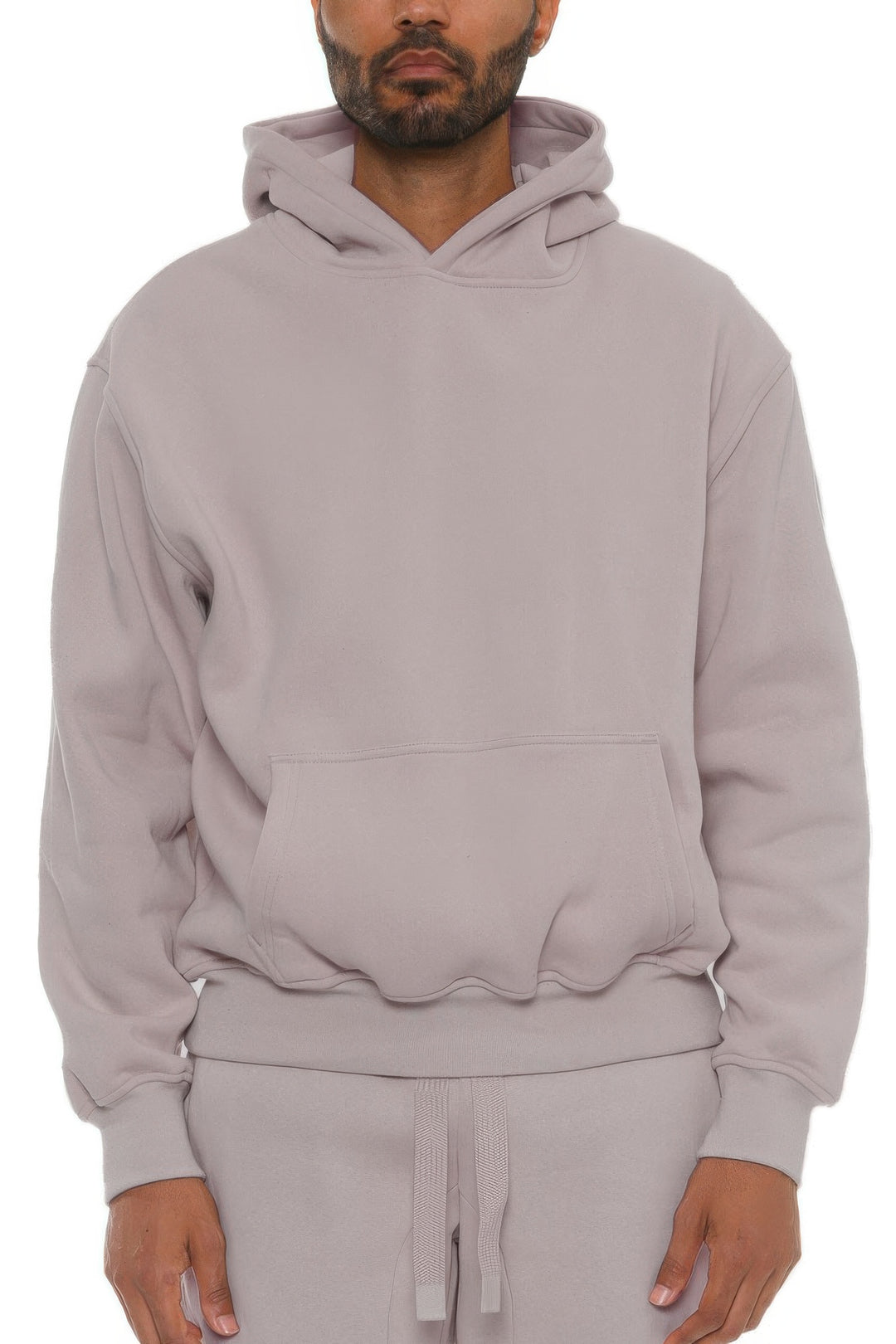 Man wearing a light gray hoodie on a white background