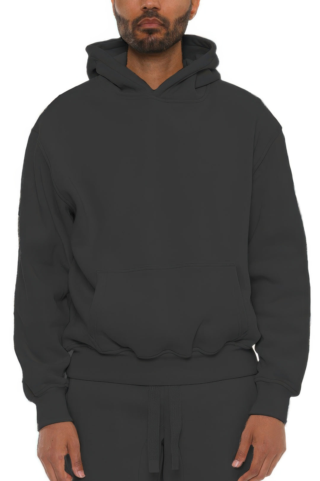 Person wearing a black hoodie on a white background
