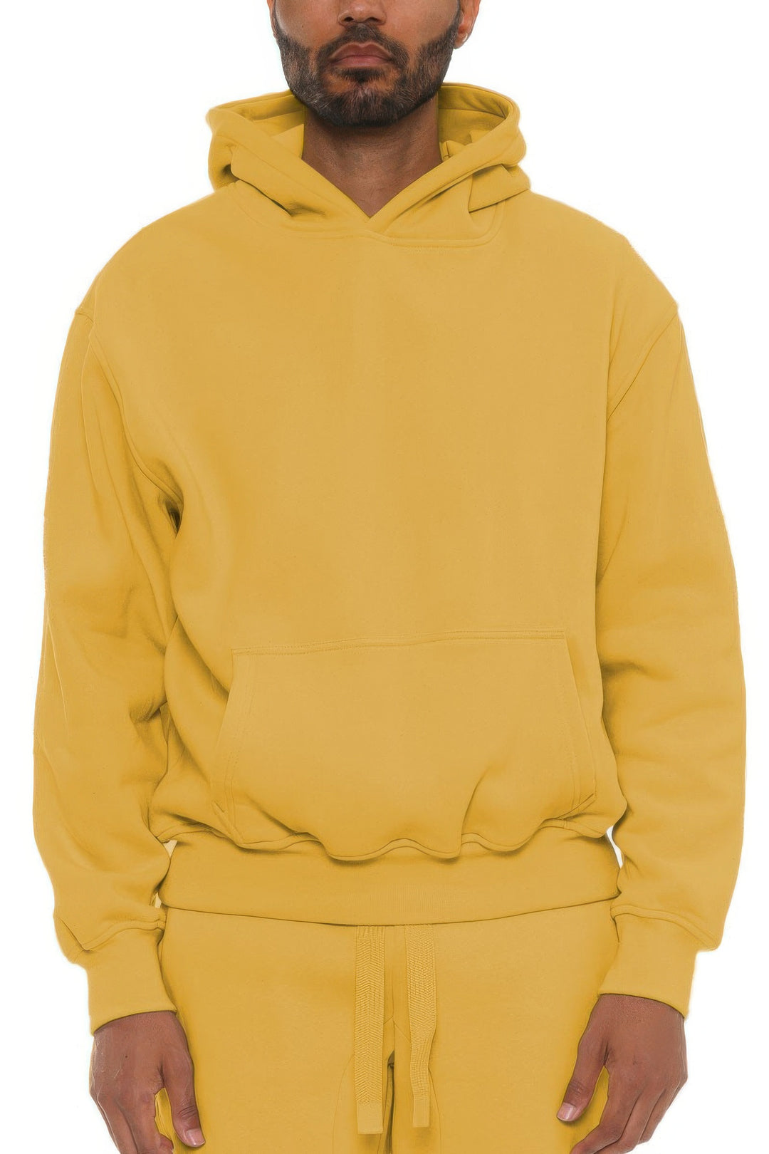 Yellow hoodie worn by a person on a white background