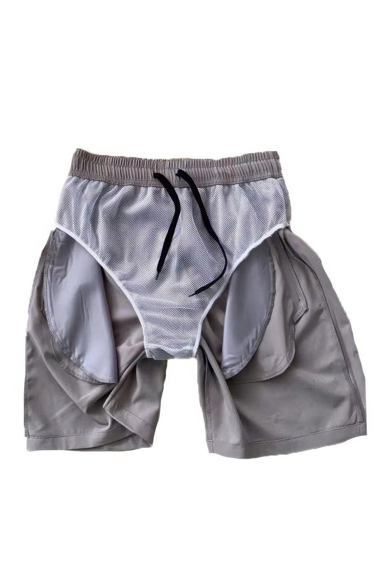Gray athletic shorts with a drawstring on a white background