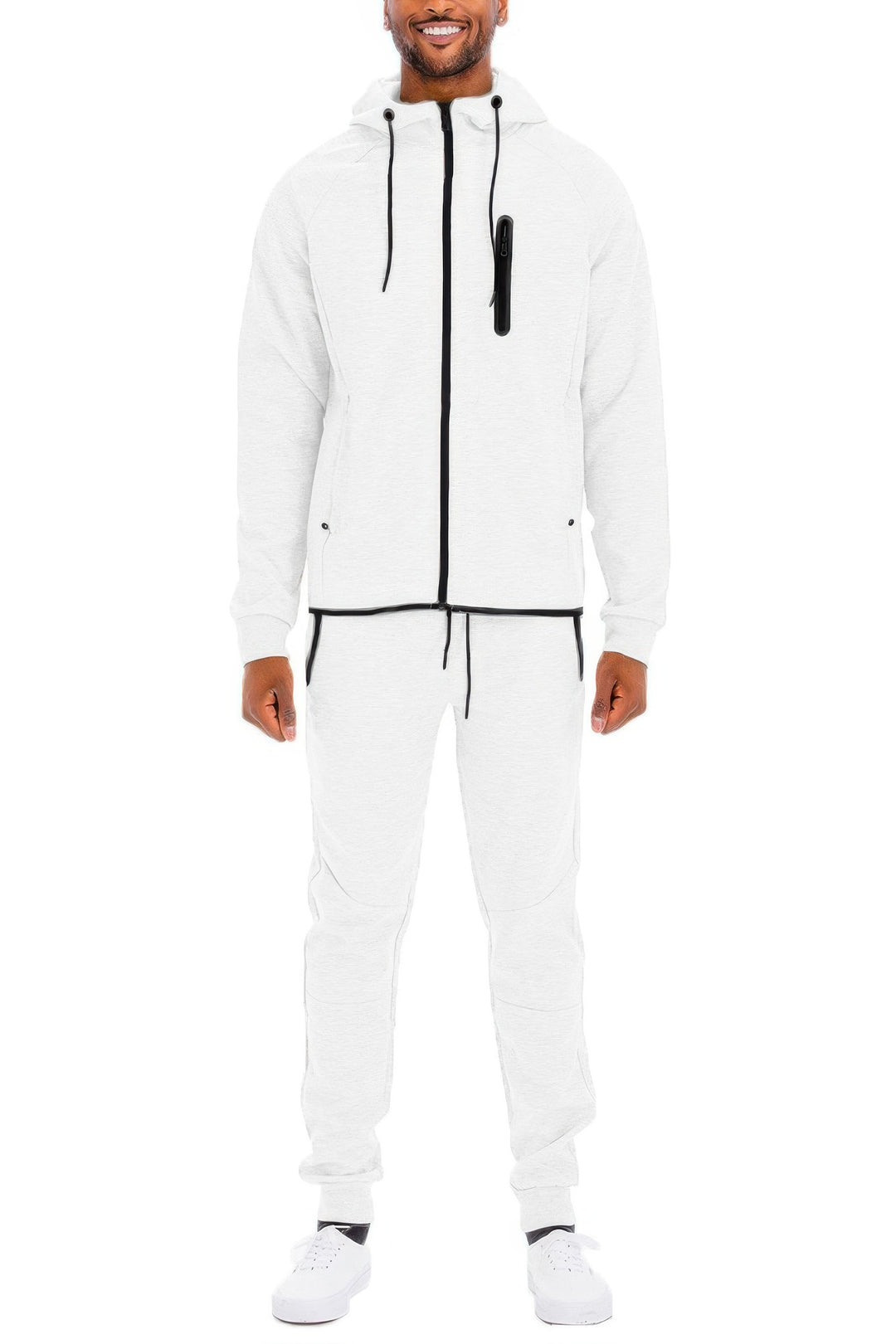 Man wearing a white tracksuit with black accents on a white background