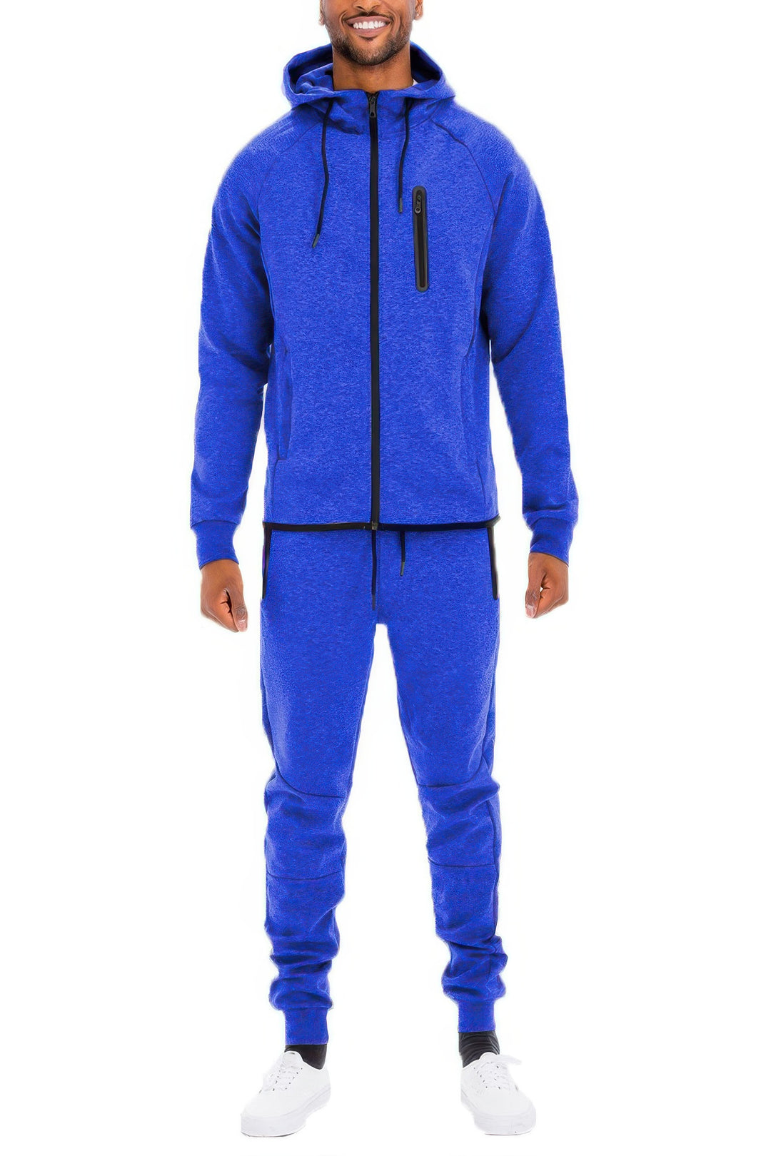 Man wearing a blue tracksuit on a white background
