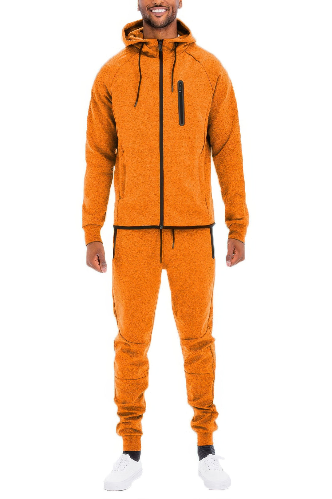 Man wearing an orange tracksuit on a white background