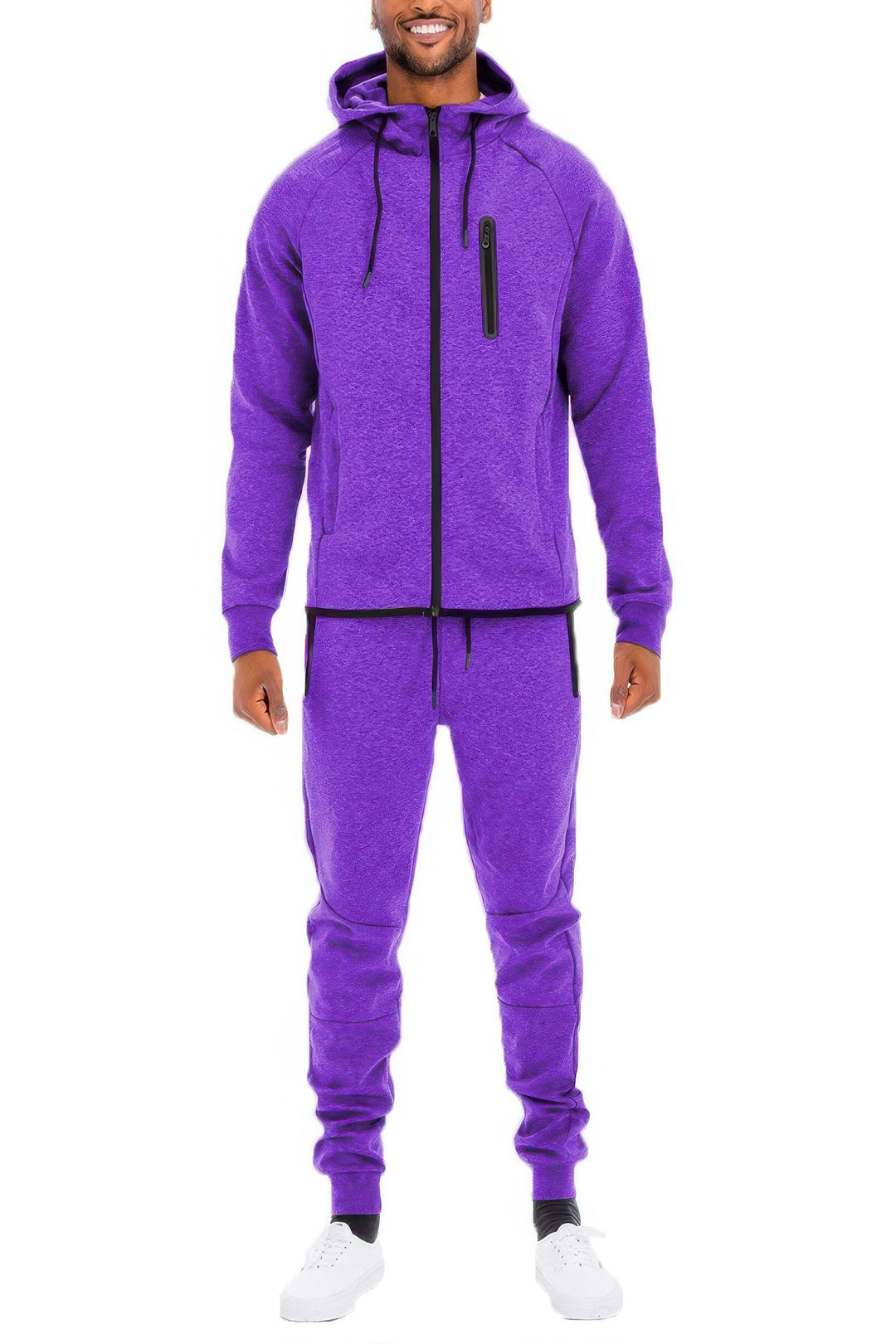 Person wearing a purple tracksuit on a white background