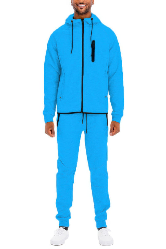 Person wearing a blue tracksuit on a white background