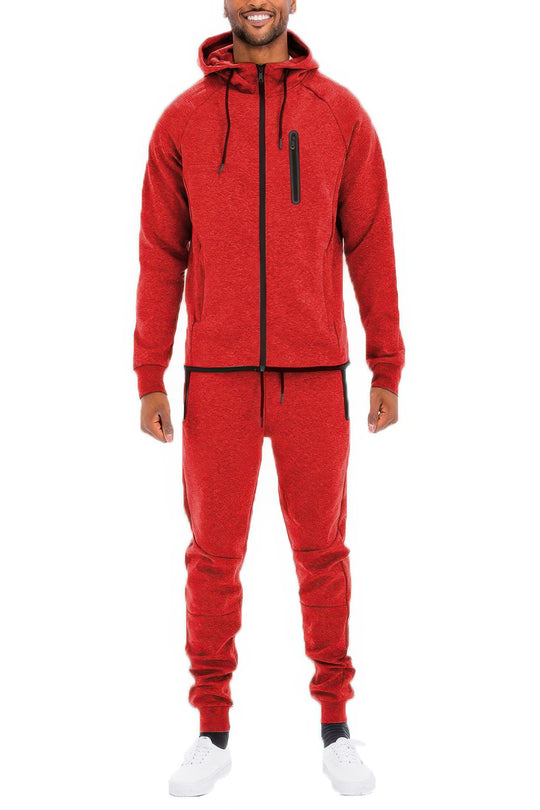 Person wearing a red tracksuit on a white background