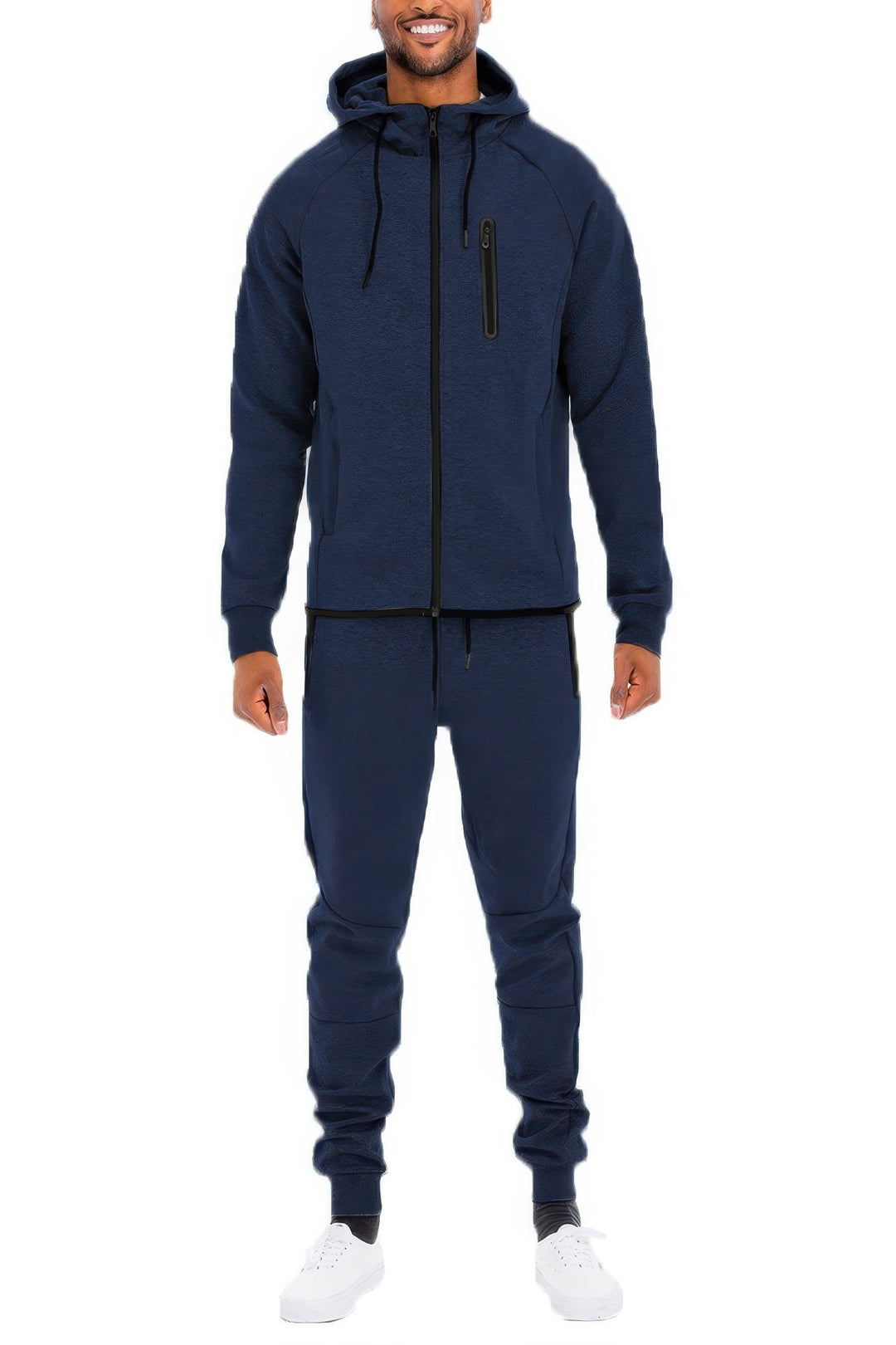Man wearing a navy blue tracksuit on a white background