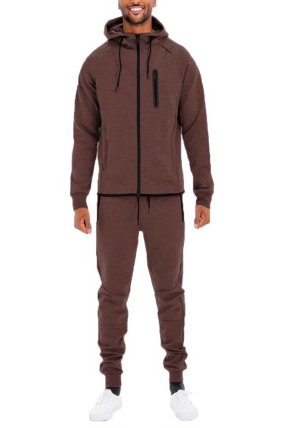 Man wearing a maroon tracksuit on a white background
