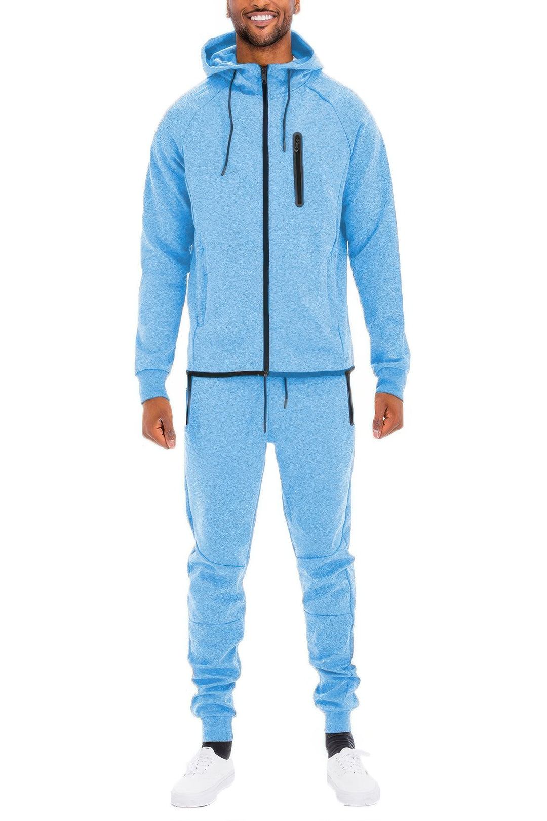 Man wearing a blue tracksuit on a white background
