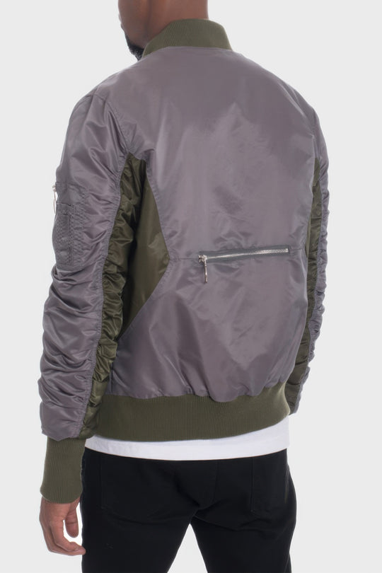 Gray and green bomber jacket on a white background
