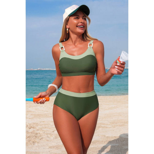 Woman in green bikini and cap on a beach