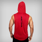 Muscular man wearing red sleeveless gym hoodie with 'JUST GYM.' text on back