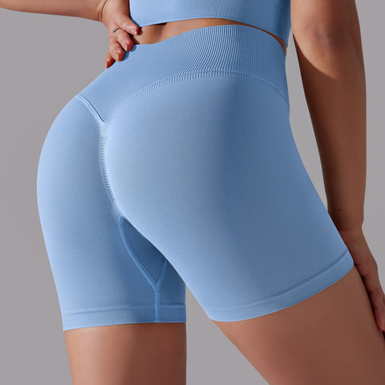 Light blue athletic shorts worn by a person on a gray background