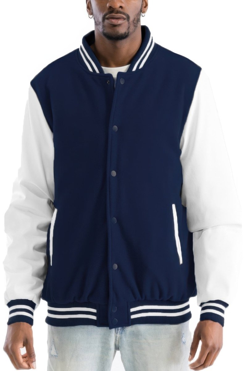Man wearing a navy and white varsity jacket on a white background