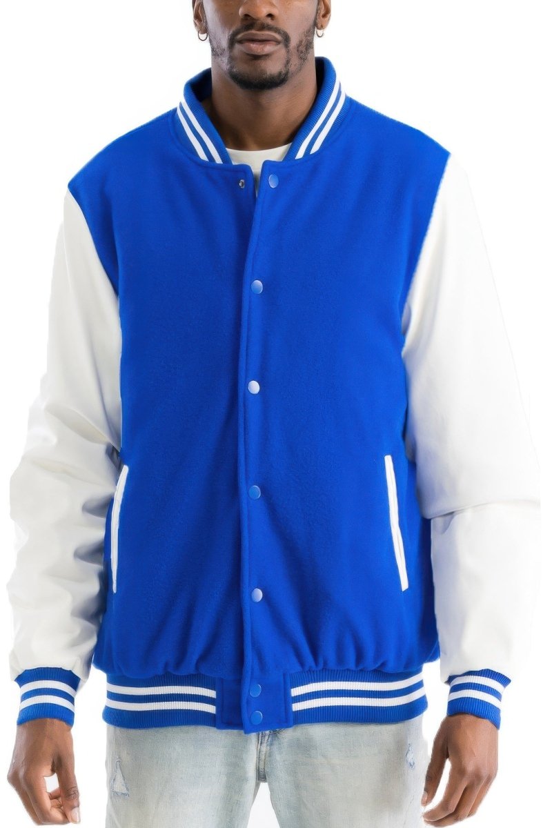 Man wearing a blue and white varsity jacket on a white background