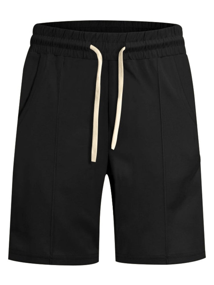 Black shorts with a beige drawstring on a white background