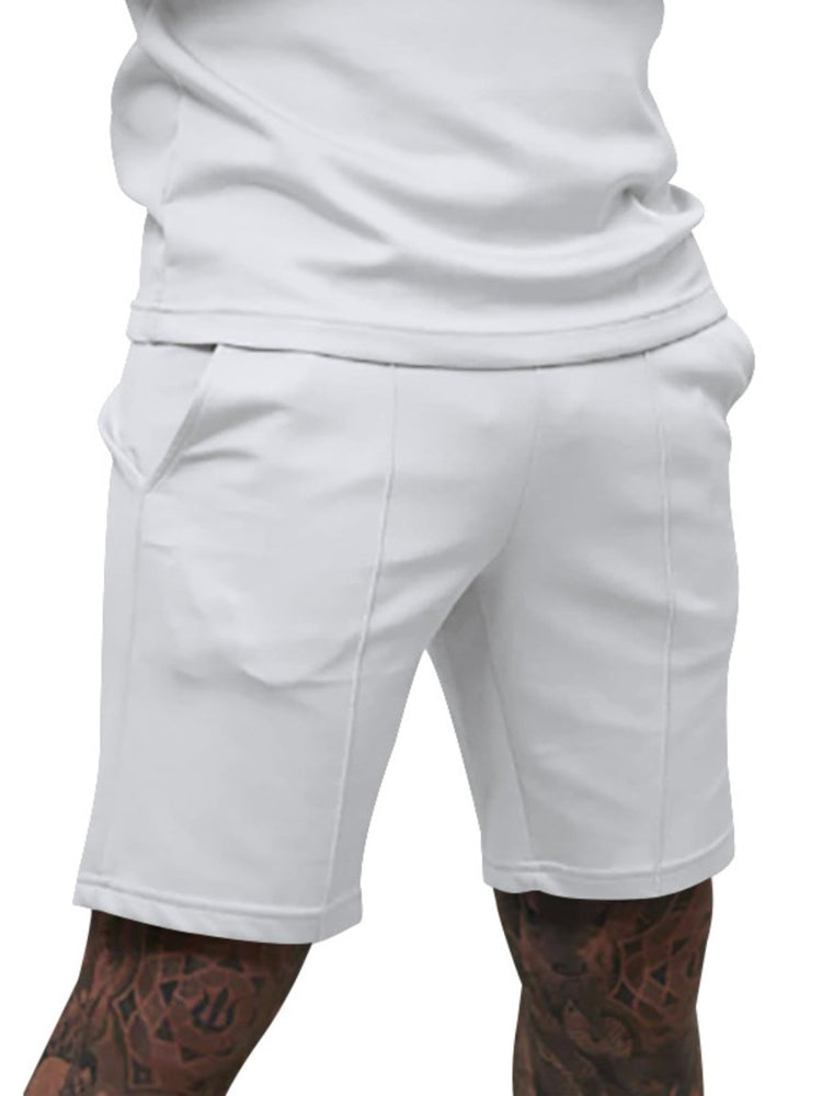 White shorts worn by a person on a white background