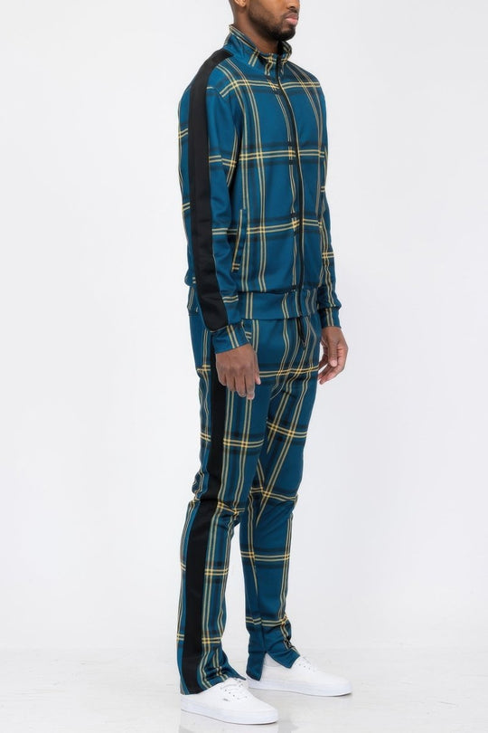 Person wearing a blue plaid outfit with black accents on a white background