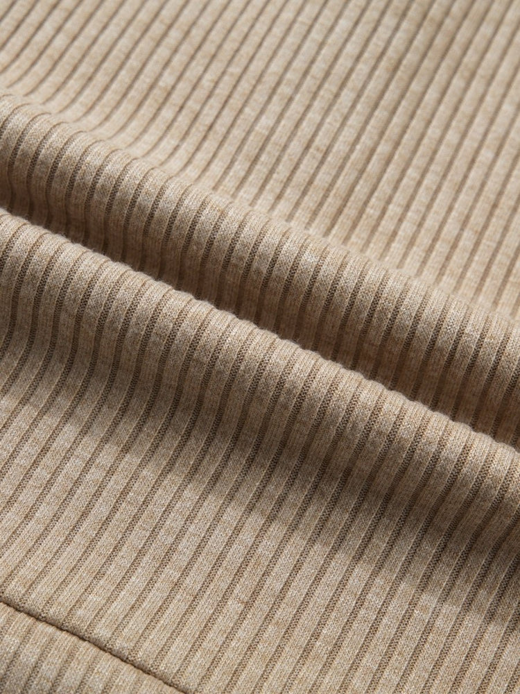Close-up of beige ribbed fabric texture