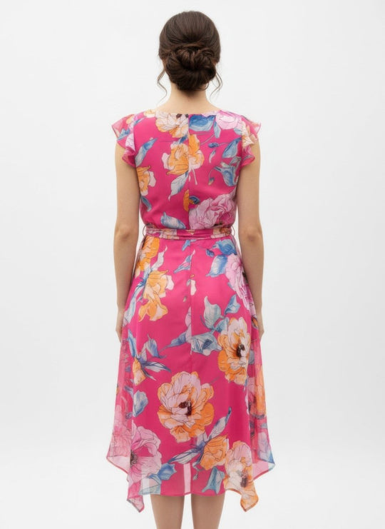 Woman wearing a pink floral dress on a white background