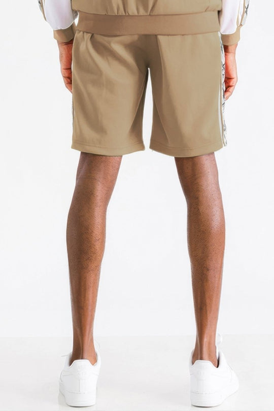 Beige shorts with a white stripe on a white background