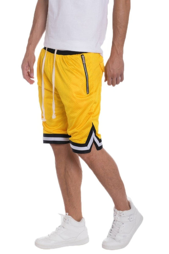 Yellow shorts with black and white accents worn by a person on a white background