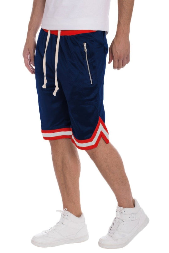 Navy shorts with red and white accents worn by a person on a white background