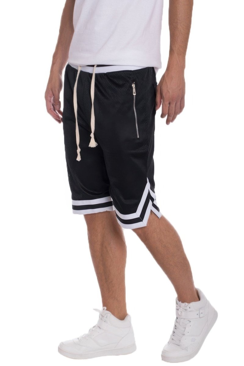 Person wearing black shorts with white stripes and a white shirt on a white background