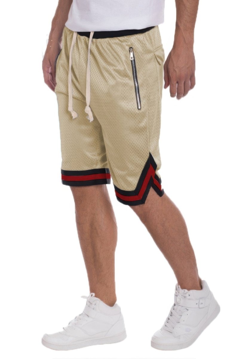 Beige shorts with red and black trim worn by a person on a white background