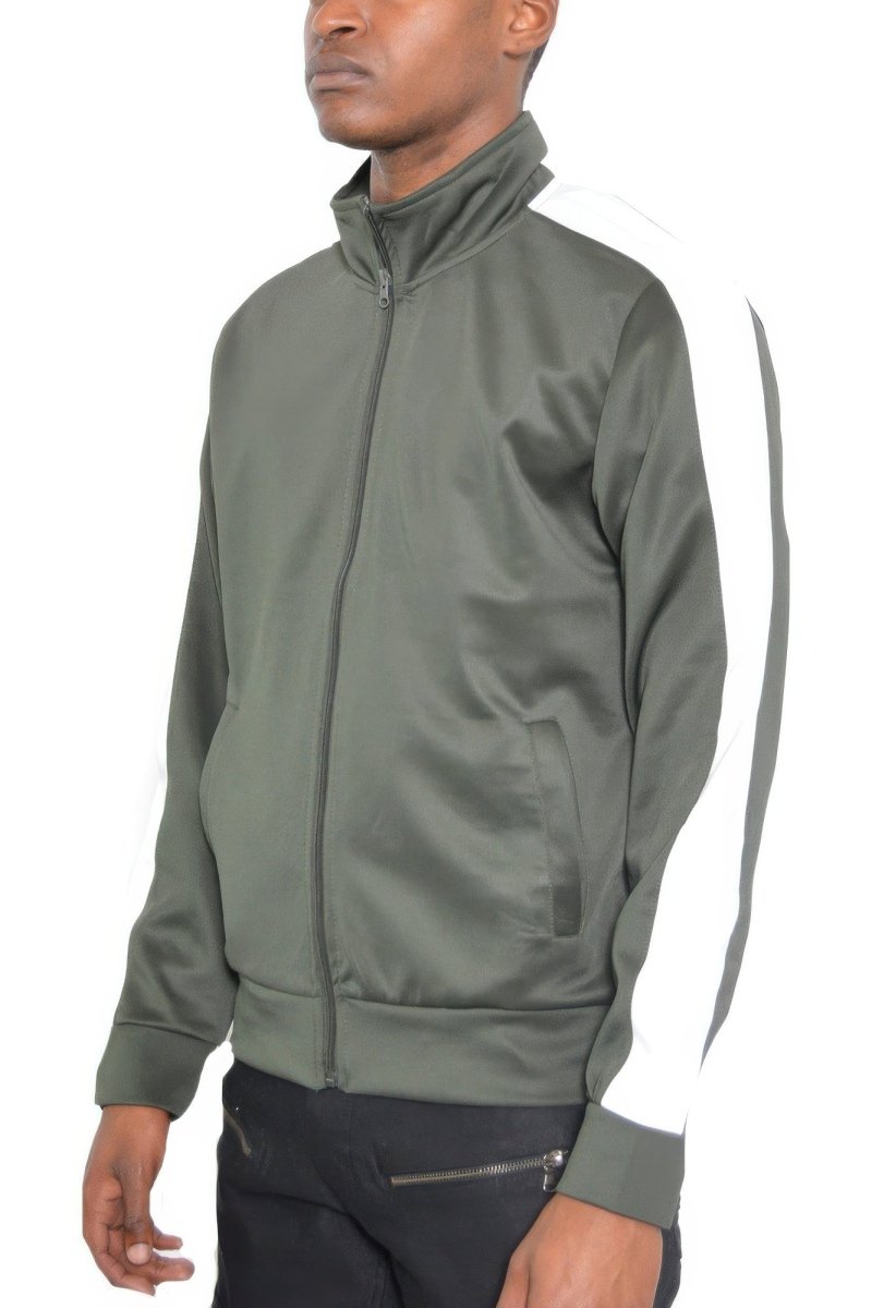 Man wearing a green tracksuit with a white stripe on a white background
